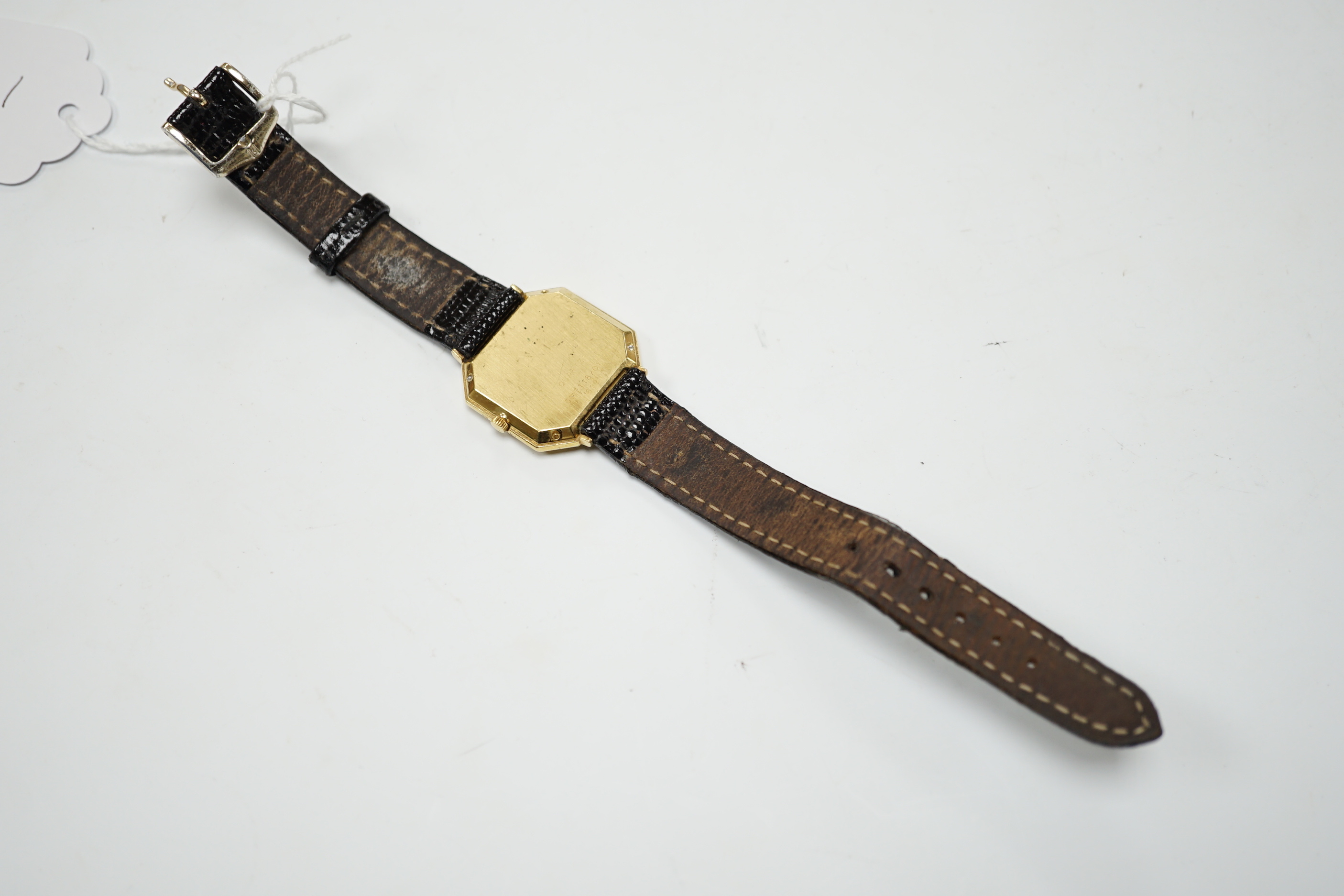 A lady's 18ct gold Chaumet quartz black dial dress wrist watch, with eight stone diamond set bezel, on an associated leather strap.